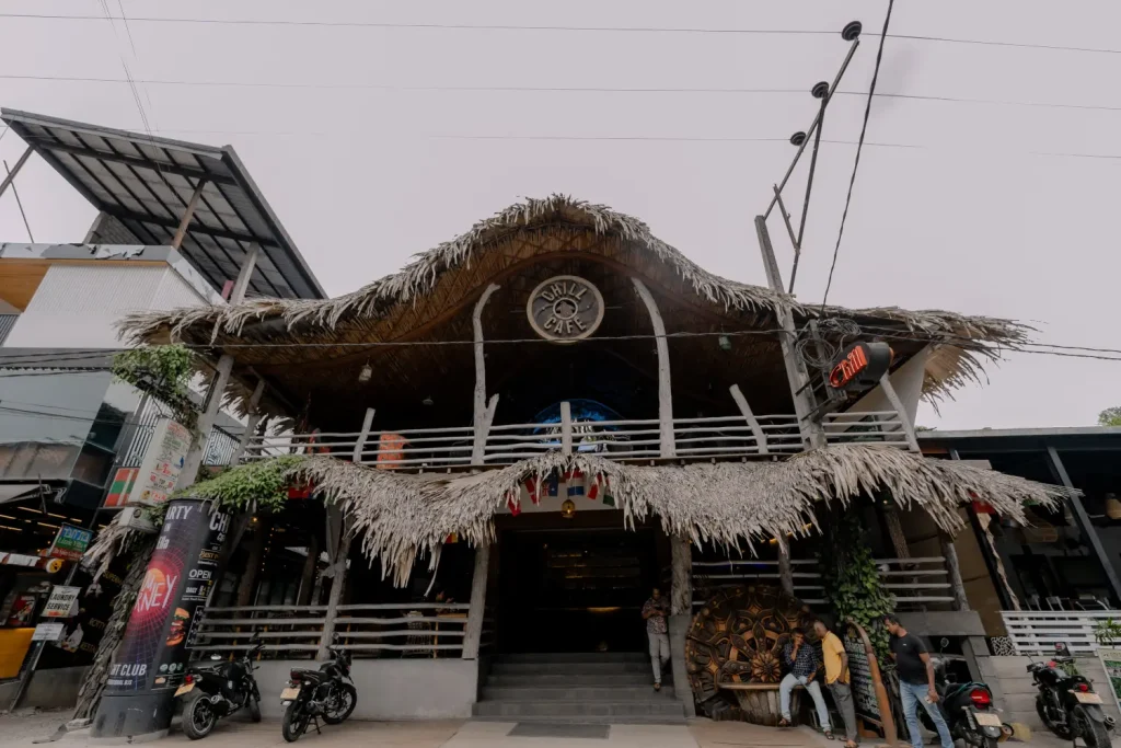 chill cafe with a thatched roof in a sri lankan beach town.