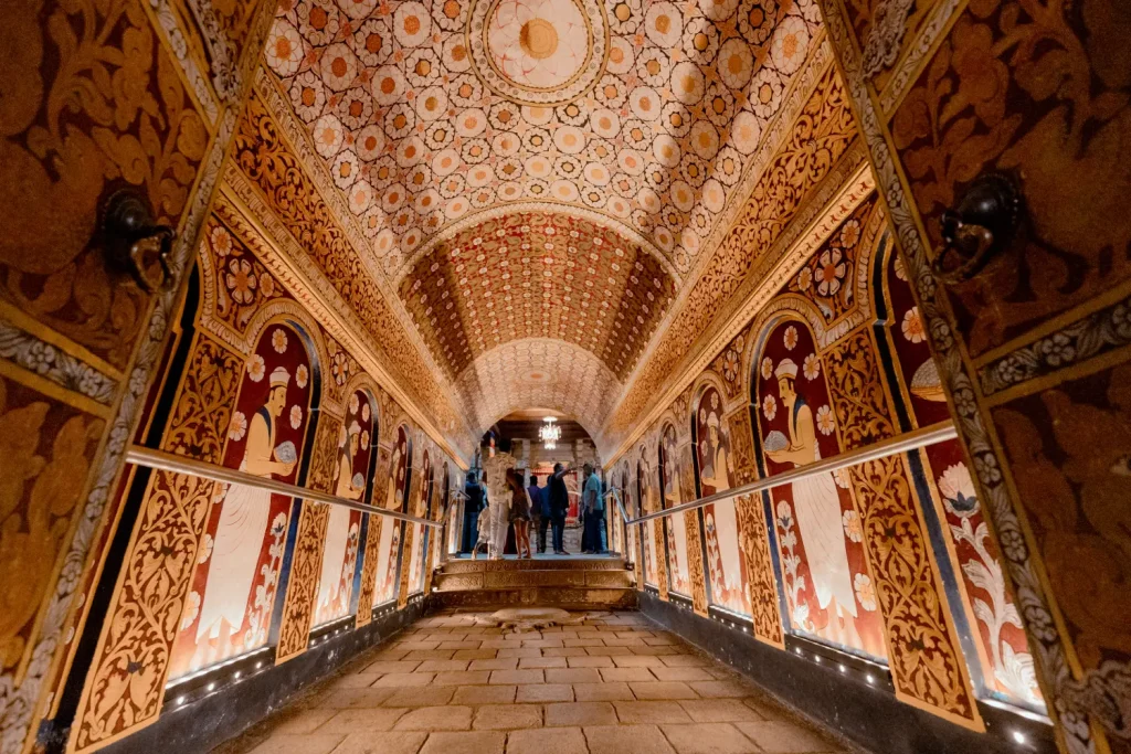 ornate, painted hallway inside the dambulla cave temple.