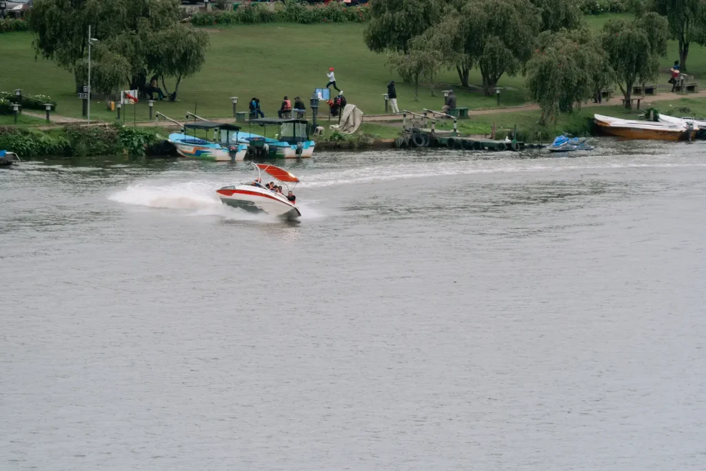 a speed boat on a lake in nuwara eliya, sri lanka.