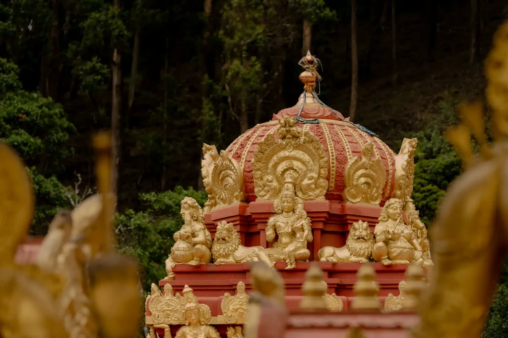 close-up of a gilded buddhist temple dome with intricate carvings in sri lanka.